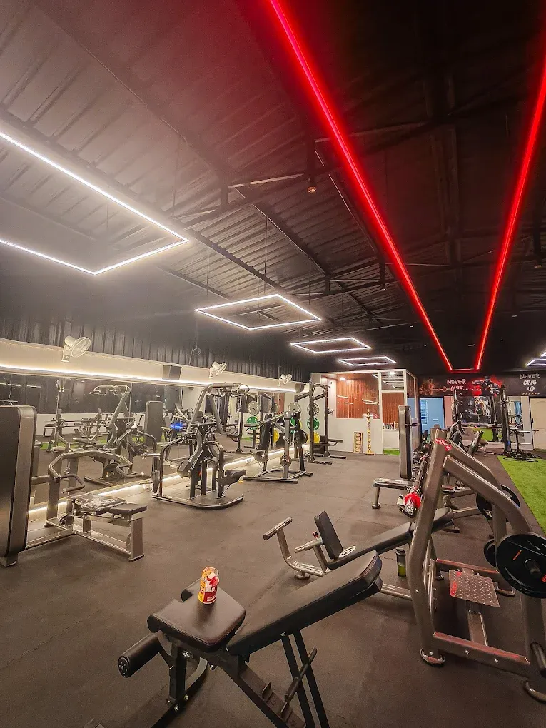 Machine floor under red LED lights at JP Fitness