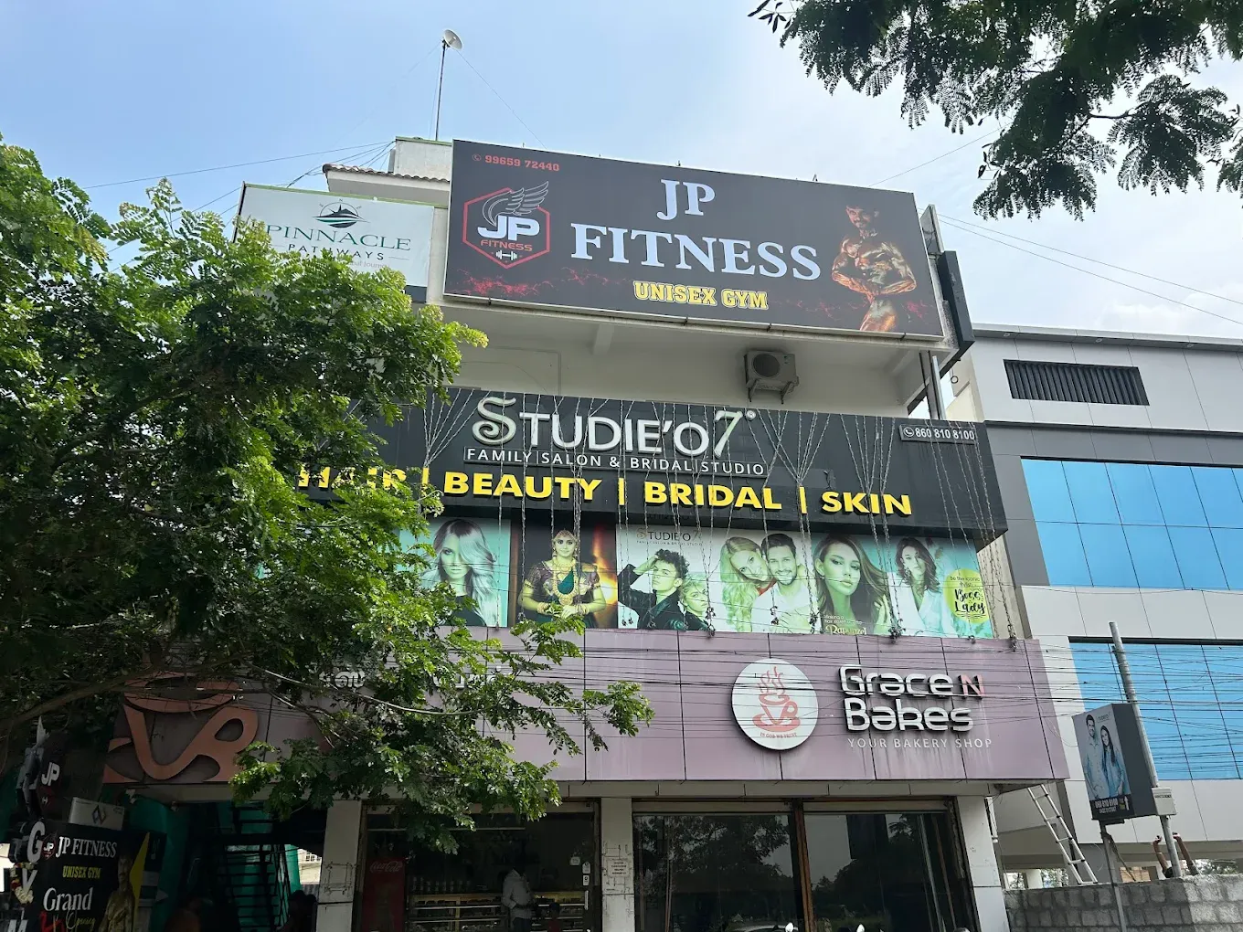 JP Fitness signboard on the DM Complex building, above Grace and Bakes on Kalapatti Main Road