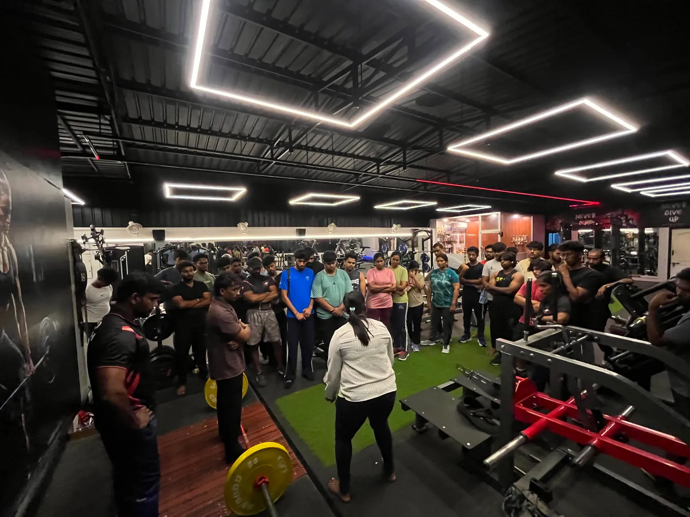 Coach addressing members at a JP Fitness meet-up